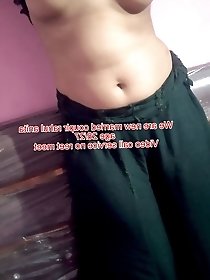 Thaiger wearing a tight skirt with a red top.