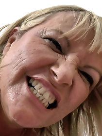 An elderly woman with sexual experience is indulging in solo play